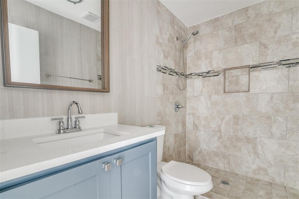 3630 Dumas Trail Garland, TX 75043 - Photo 11 of 12 a bathroom with a sink a toilet and shower