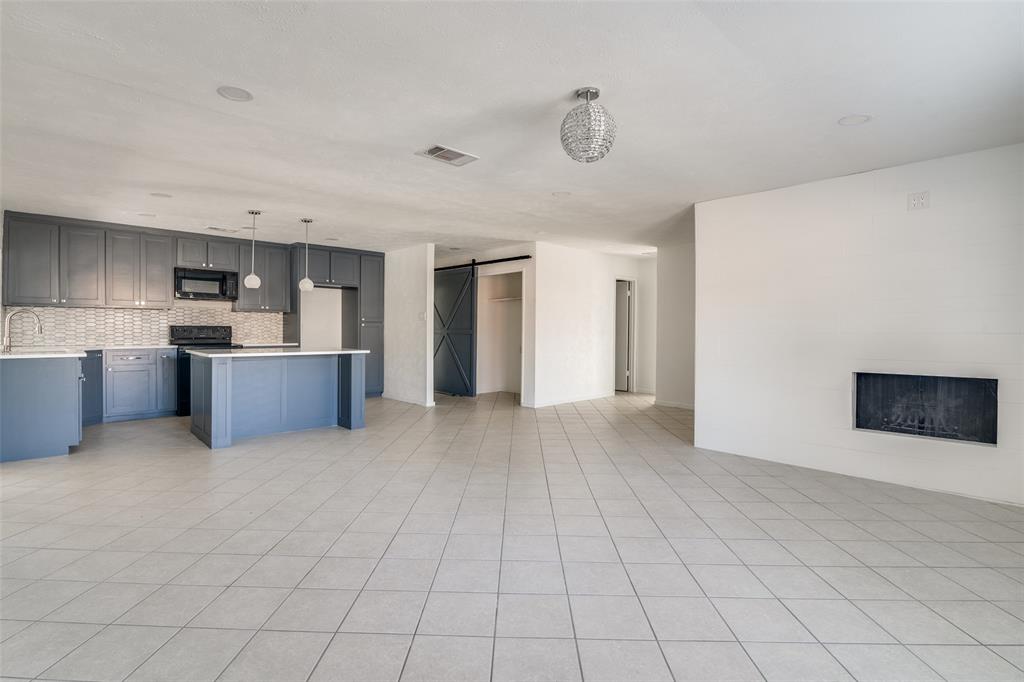 3630 Dumas Trail Garland, TX 75043 - Photo 4 of 12 a view of a kitchen with furniture and an empty room