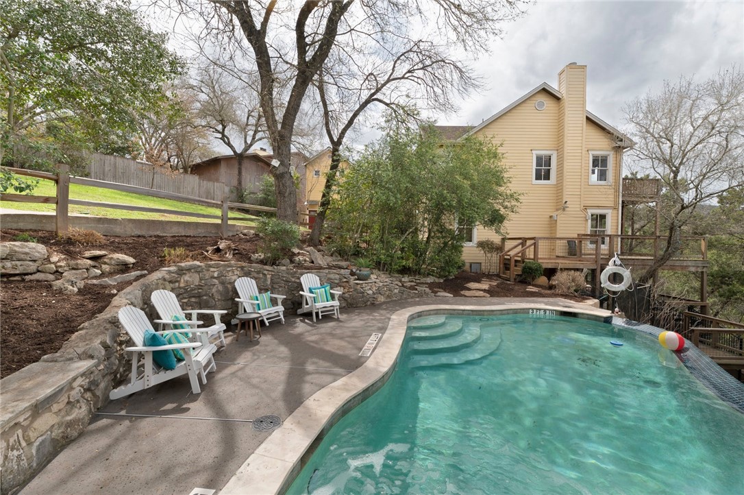 a view of a backyard with sitting area