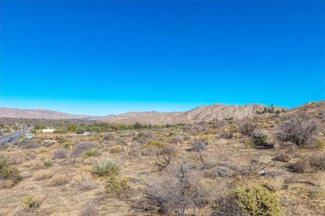 a view of a town with mountains in the background
