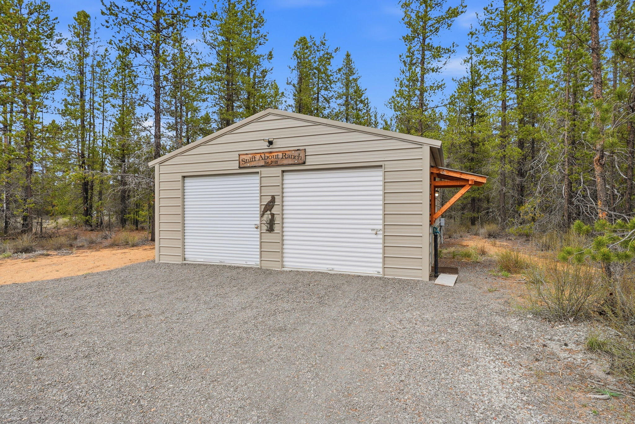 54270 Huntington Road La Pine, OR 97739 - Photo 58 of 68 a view of a house with a yard and garage