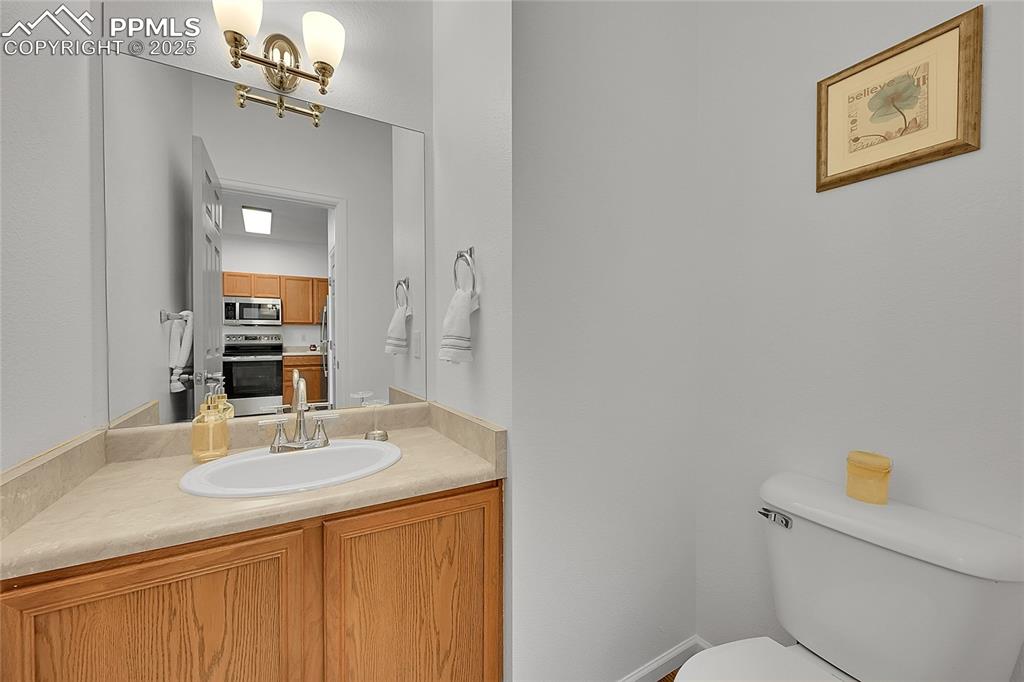 6232 Sierra Grande Point Colorado Springs, CO 80923 - Photo 13 of 31 a bathroom with a sink and a mirror