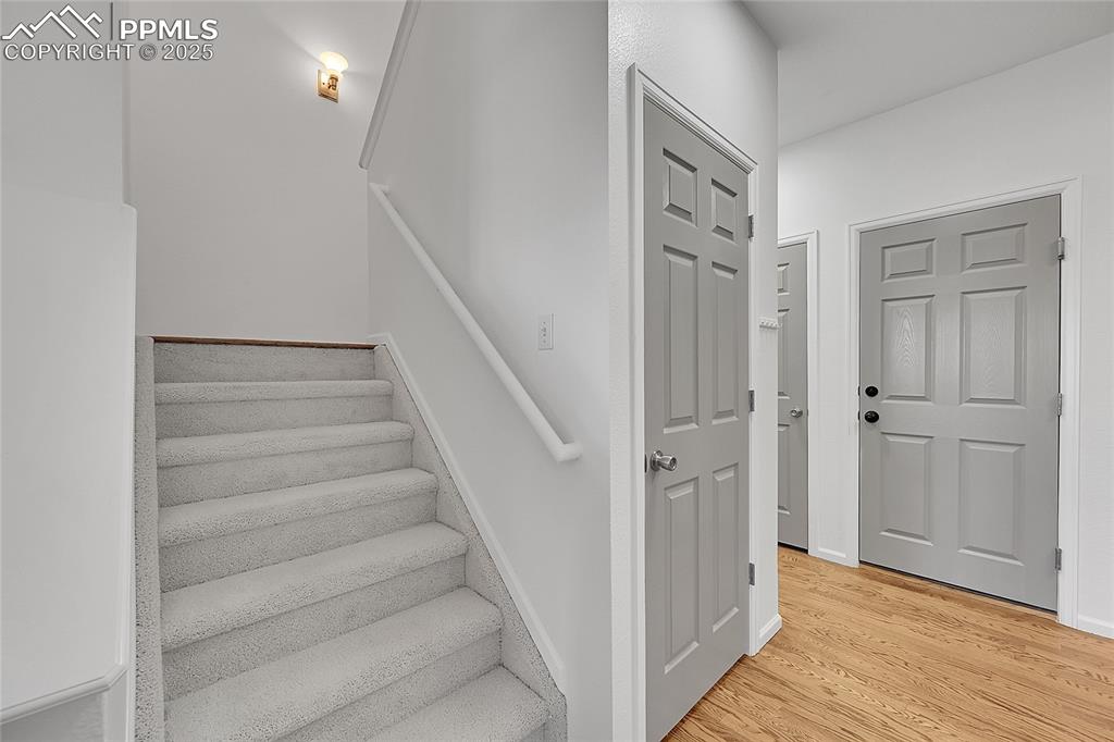 6232 Sierra Grande Point Colorado Springs, CO 80923 - Photo 14 of 31 a view of an entryway with staircase