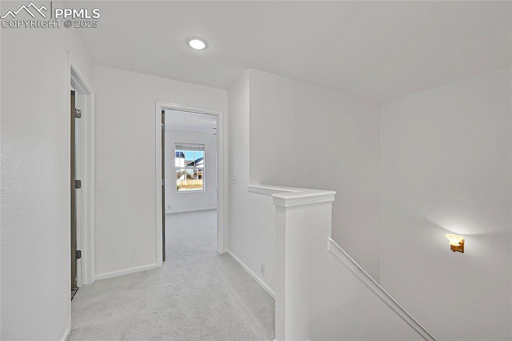 6232 Sierra Grande Point Colorado Springs, CO 80923 - Photo 15 of 31 a view of an entryway with wooden floor