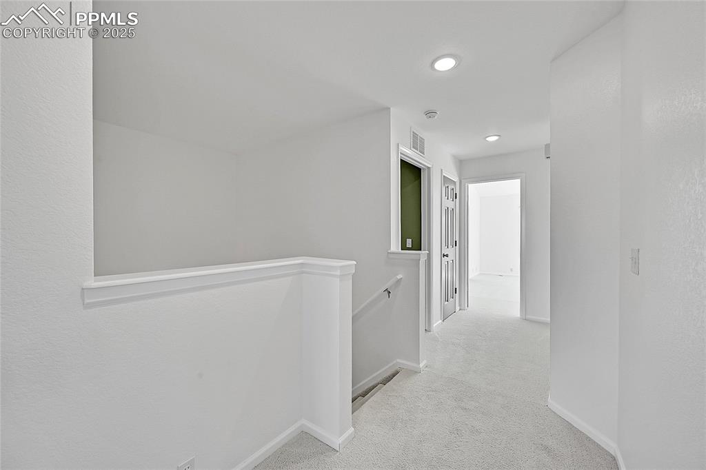 6232 Sierra Grande Point Colorado Springs, CO 80923 - Photo 17 of 31 a view of a hallway with closet