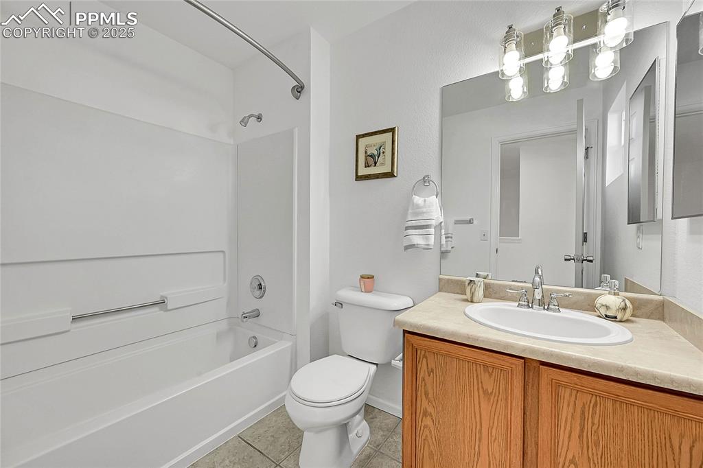 6232 Sierra Grande Point Colorado Springs, CO 80923 - Photo 22 of 31 a bathroom with a sink a toilet and shower