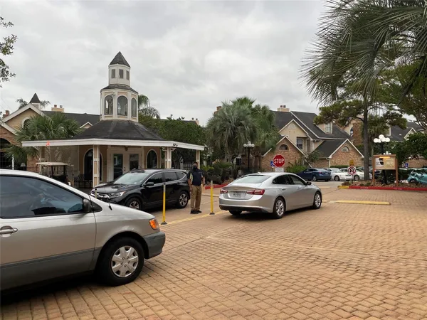 a view of street with parked cars