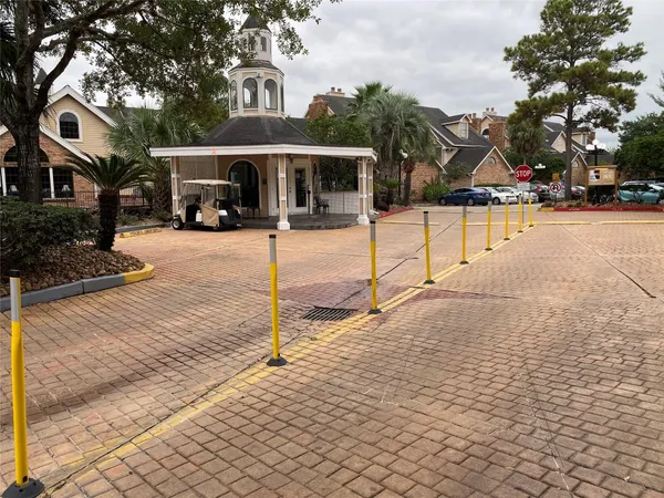 a view of a white house with a yard