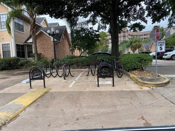 a view of backyard with swimming pool and furniture