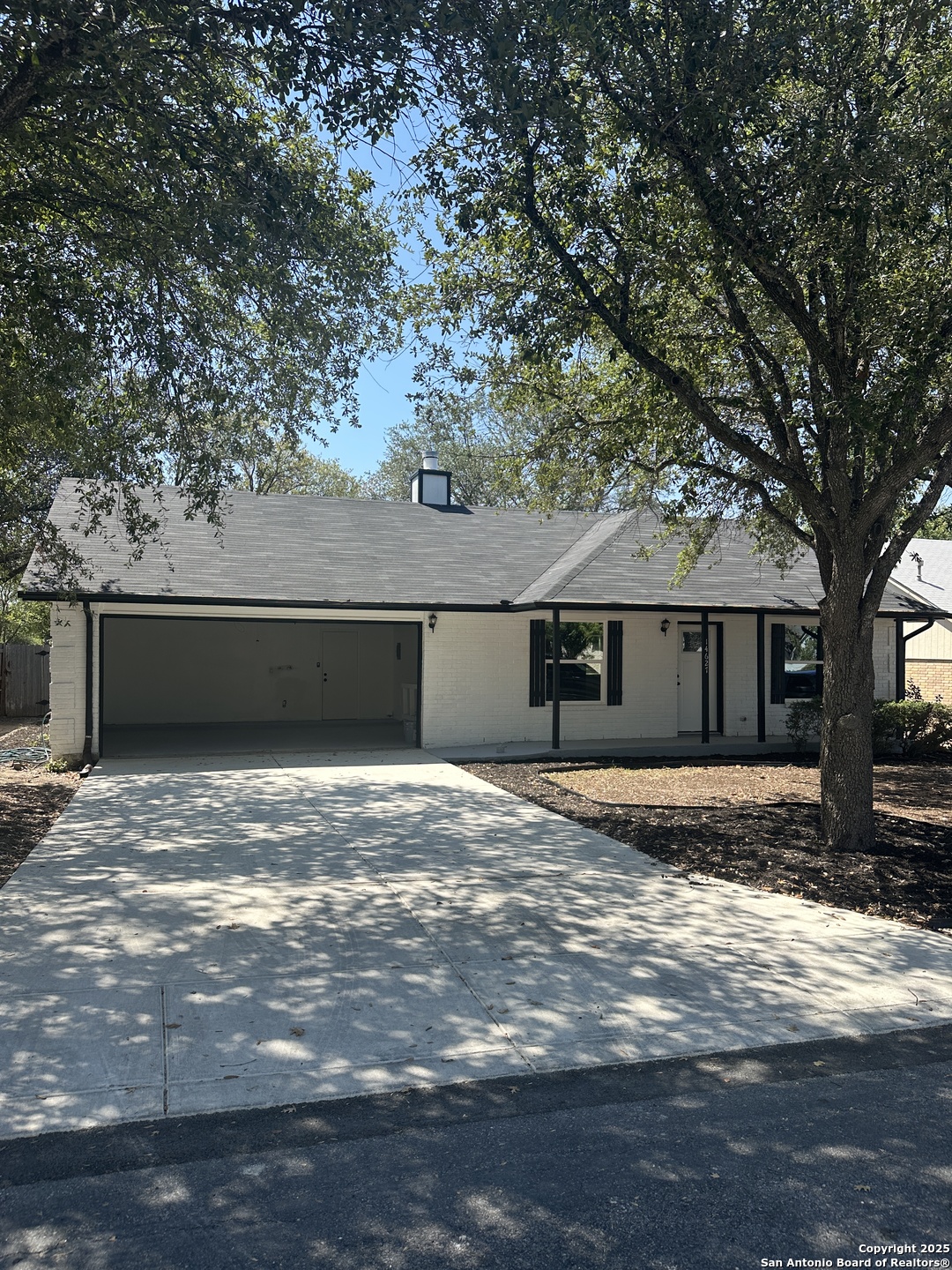 14627 Highland Ridge San Antonio, TX 78233 - Photo 2 of 25 a house that has a tree in front of it
