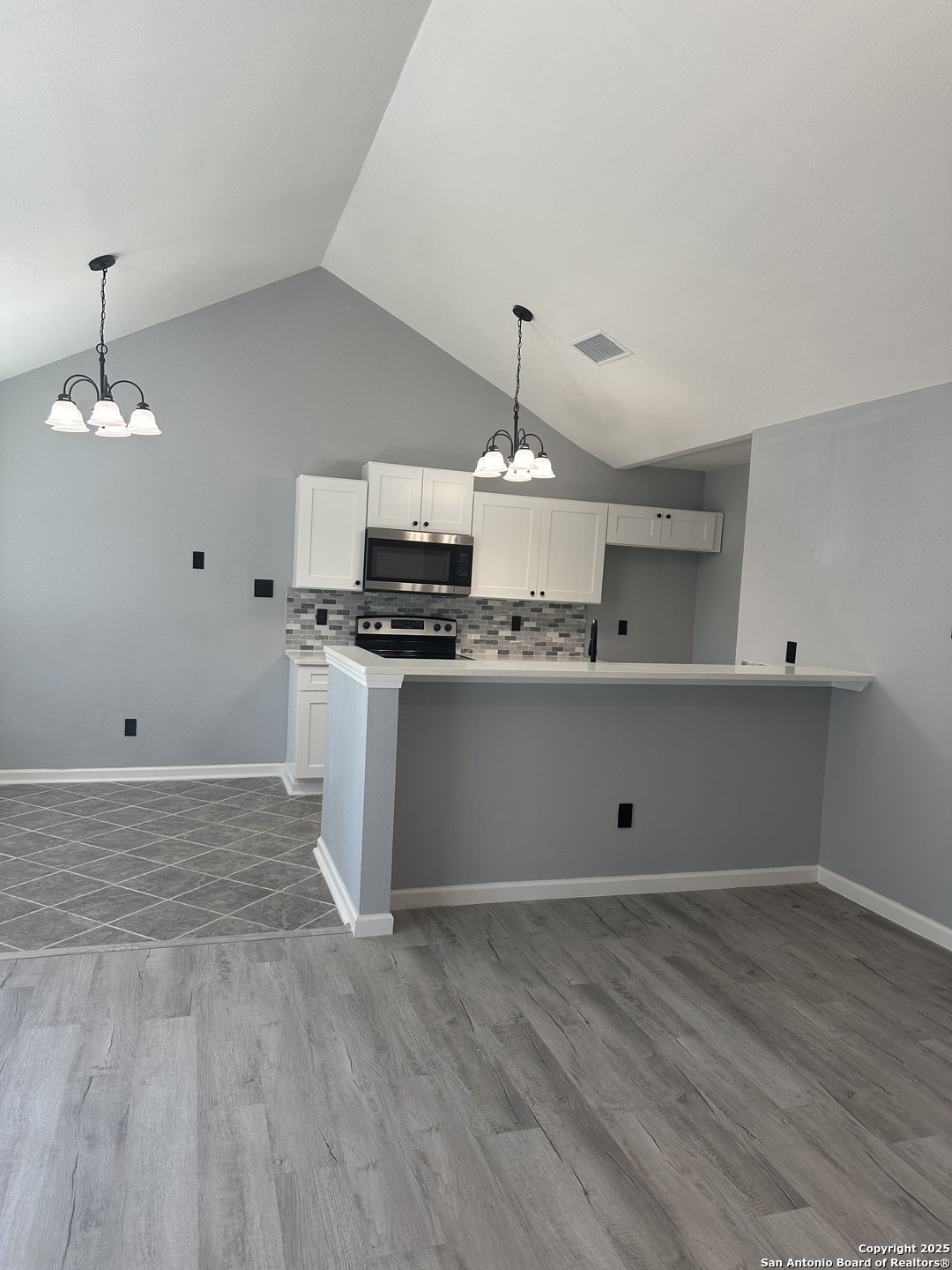 14627 Highland Ridge San Antonio, TX 78233 - Photo 7 of 25 a view of a kitchen with a sink and wooden floor