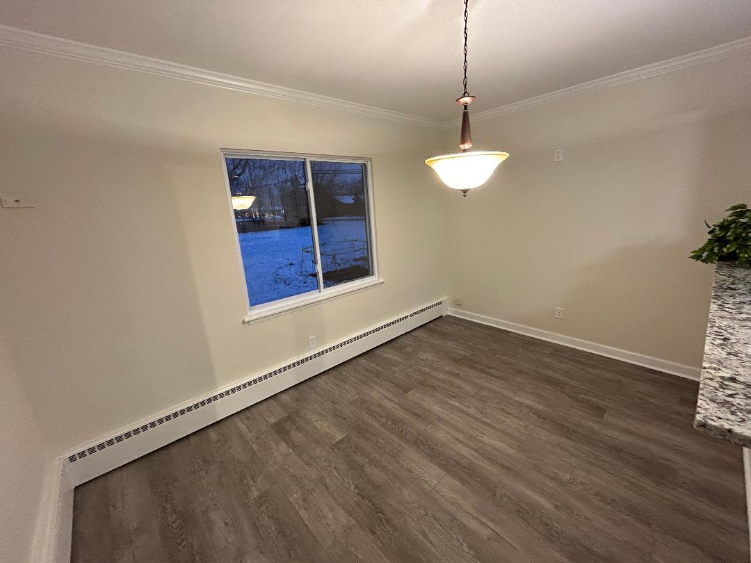 369 North Independence Boulevard Romeoville, IL 60446 - Photo 13 of 36 an empty room with wooden floor and windows