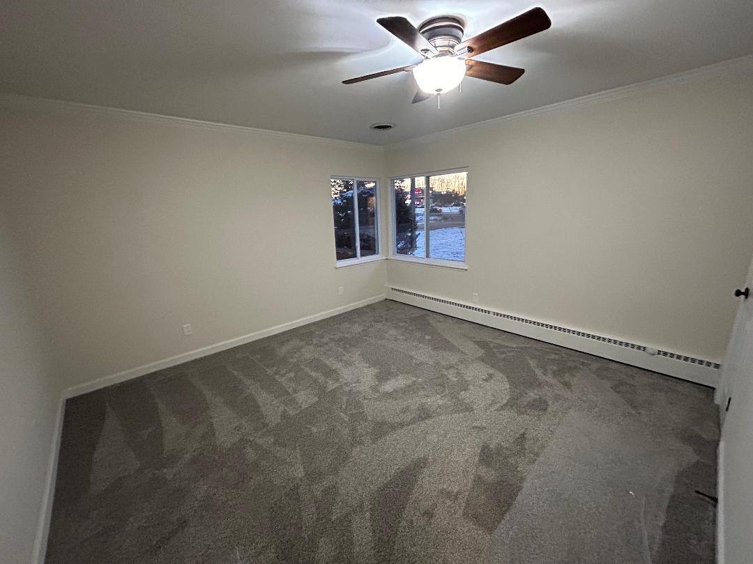 369 North Independence Boulevard Romeoville, IL 60446 - Photo 16 of 36 an empty room with chandelier fan