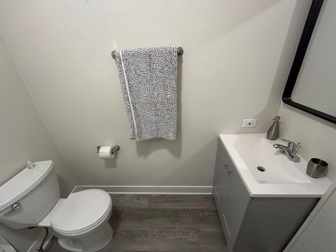 369 North Independence Boulevard Romeoville, IL 60446 - Photo 18 of 36 a bathroom with a toilet sink and mirror