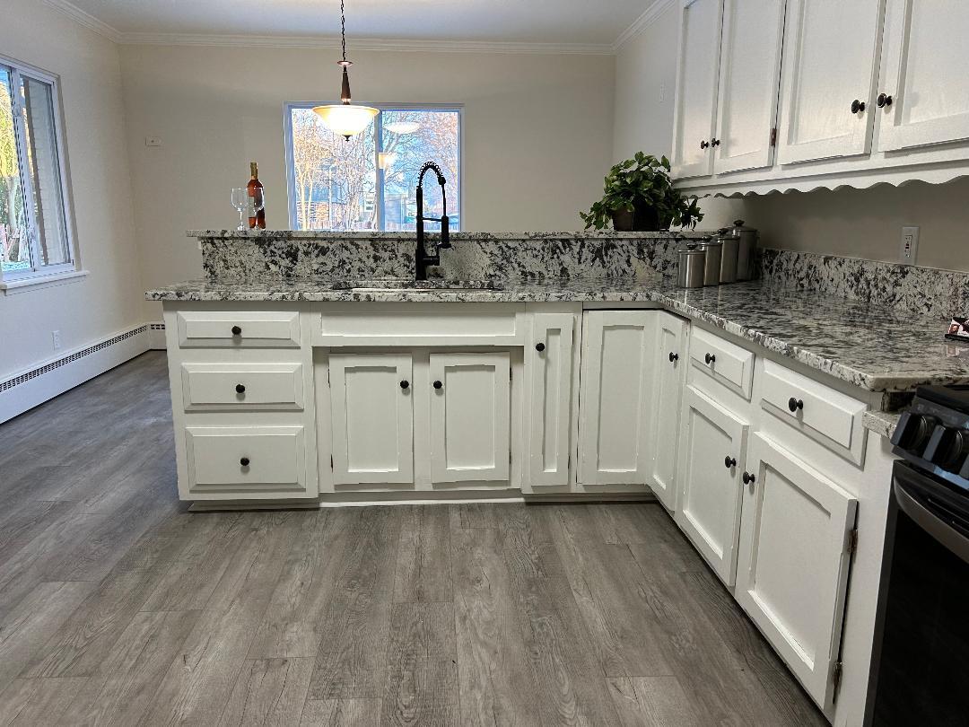369 North Independence Boulevard Romeoville, IL 60446 - Photo 2 of 36 a kitchen with stainless steel appliances granite countertop a sink stove and cabinets