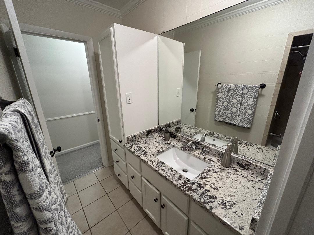 369 North Independence Boulevard Romeoville, IL 60446 - Photo 24 of 36 a bathroom with a granite countertop sink and a mirror