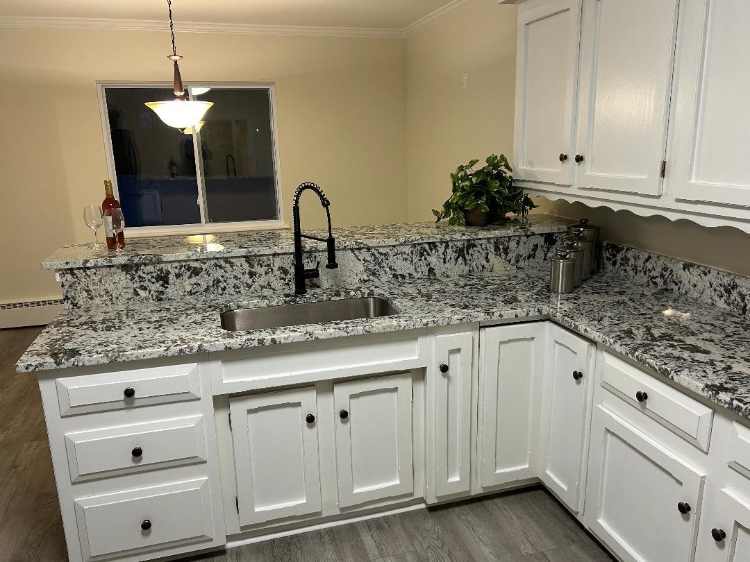 369 North Independence Boulevard Romeoville, IL 60446 - Photo 4 of 36 a kitchen with white cabinets and sink