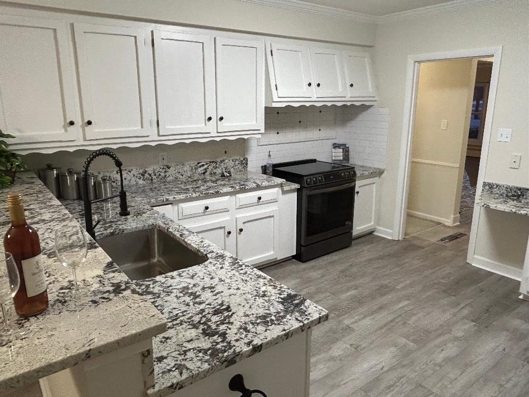 369 North Independence Boulevard Romeoville, IL 60446 - Photo 6 of 36 a kitchen with a sink stove and cabinets