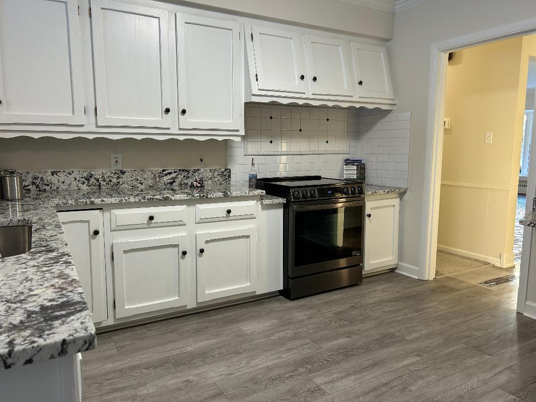 369 North Independence Boulevard Romeoville, IL 60446 - Photo 9 of 36 a kitchen with white cabinets and appliances