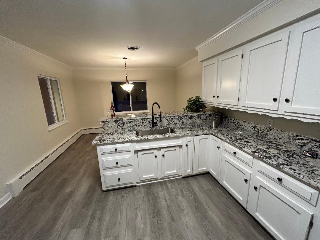 369 North Independence Boulevard Romeoville, IL 60446 - Photo 10 of 36 a large white kitchen with granite top and stainless steel appliances