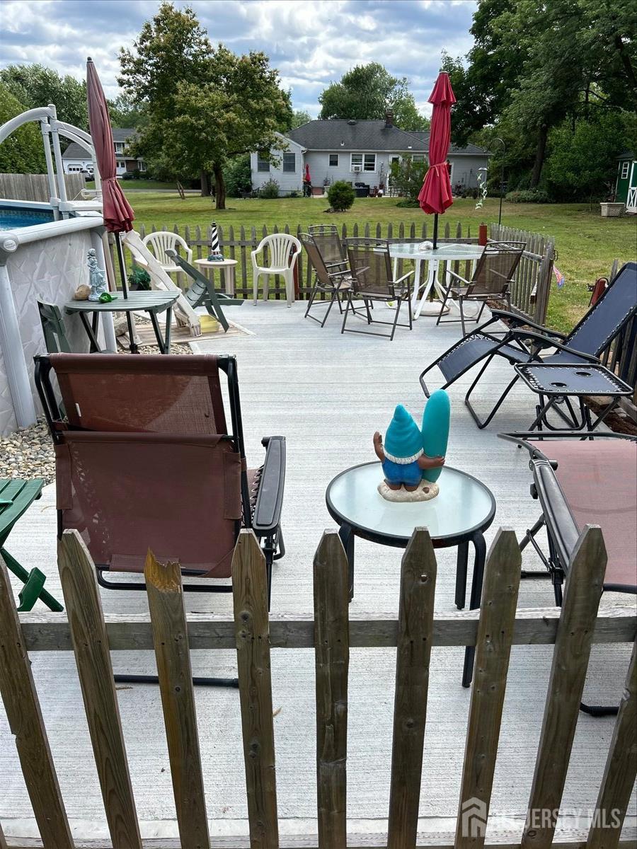33 Ellison Road Somerset, NJ 08873 - Photo 33 of 38 a view of an chairs and table in patio