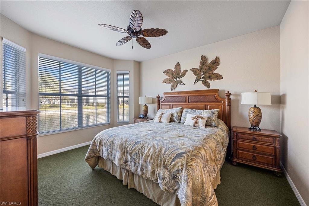 Undisclosed Address Naples, FL 34113 - Photo 12 of 38 a bedroom with a bed and wooden floor