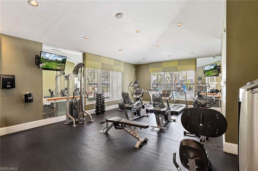 Undisclosed Address Naples, FL 34113 - Photo 25 of 38 a room with lots of chairs and a large window