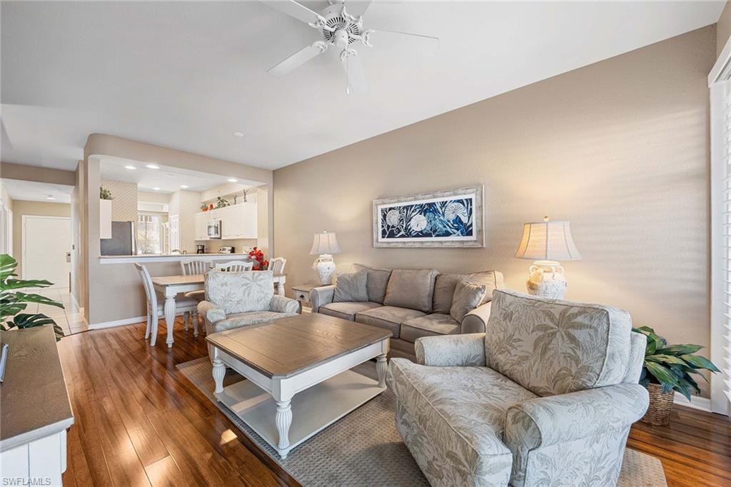 Undisclosed Address Naples, FL 34113 - Photo 3 of 38 a living room with furniture and a table