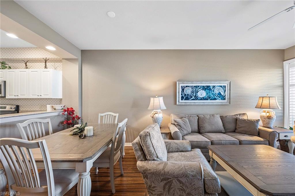 Undisclosed Address Naples, FL 34113 - Photo 5 of 38 a living room with furniture and a wooden floor