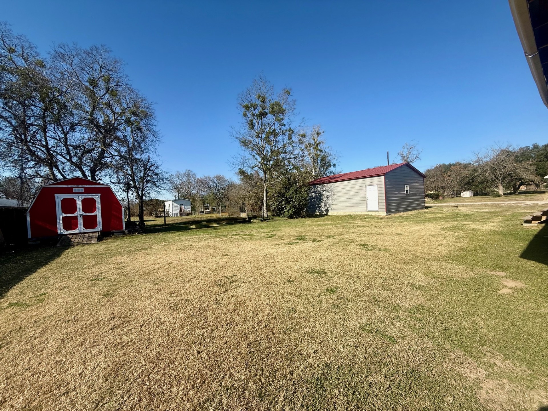 845 Caldwell Street Lexington, TX 78947 - Photo 39 of 39 View of grassy yard with a shed