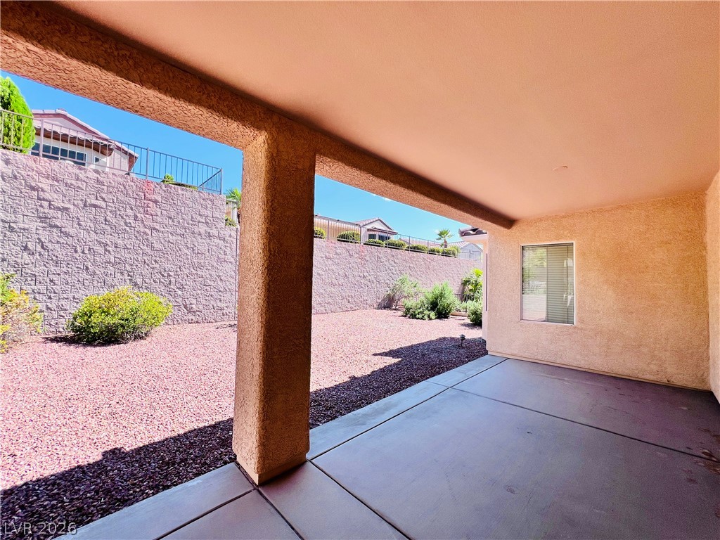 3047 Hickory Valley Road Henderson, NV 89052 - Photo 26 of 33 A shaded patio provides a tranquil escape overlooking the landscaped private yard.