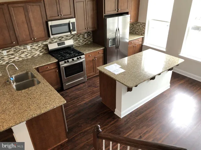 a kitchen with a stove and a microwave