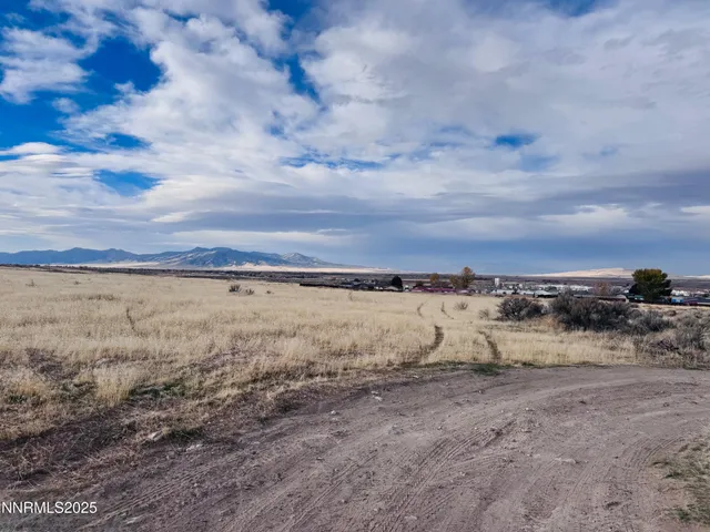 a view of a large body of water and mountain view in back