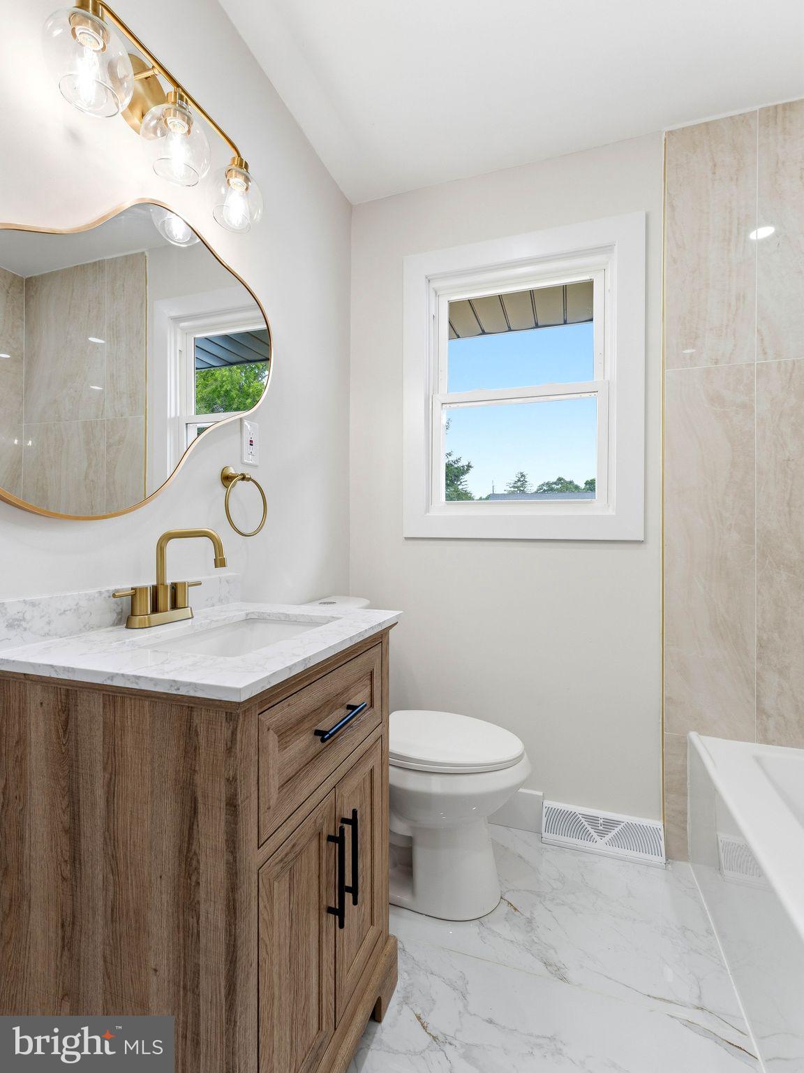 513 Jefferson Street Riverside, NJ 08075 - Photo 23 of 29 Modern elegance in a serene bathroom.