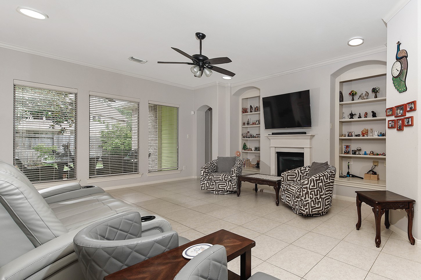 18722 Duke Lake Drive Spring, TX 77388 - Photo 8 of 26 a living room with furniture a fireplace and a flat screen tv
