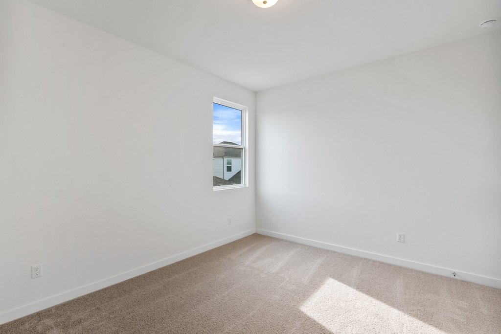 2205 Cento Walk Round Rock, TX 78664 - Photo 25 of 35 Empty room featuring baseboards and carpet floors