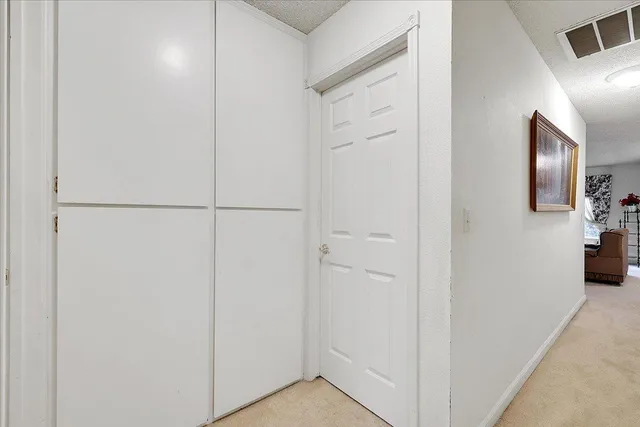 a view of a hallway with elevator