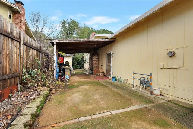 a view of a chairs and table in the patio