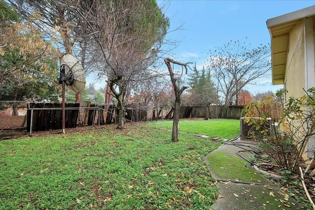 a backyard of a house with lots of green space