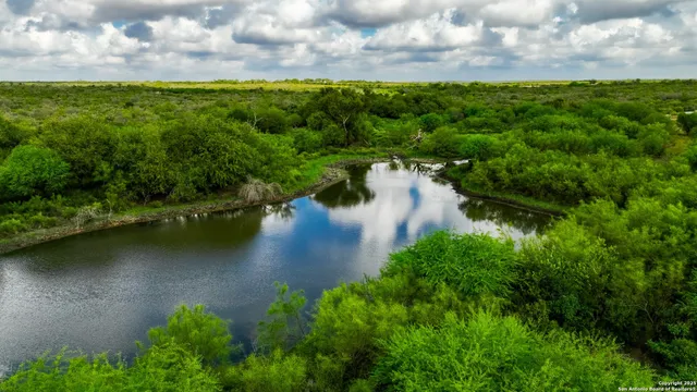 a view of a lake with a yard