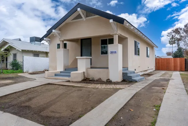 a front view of house with a yard