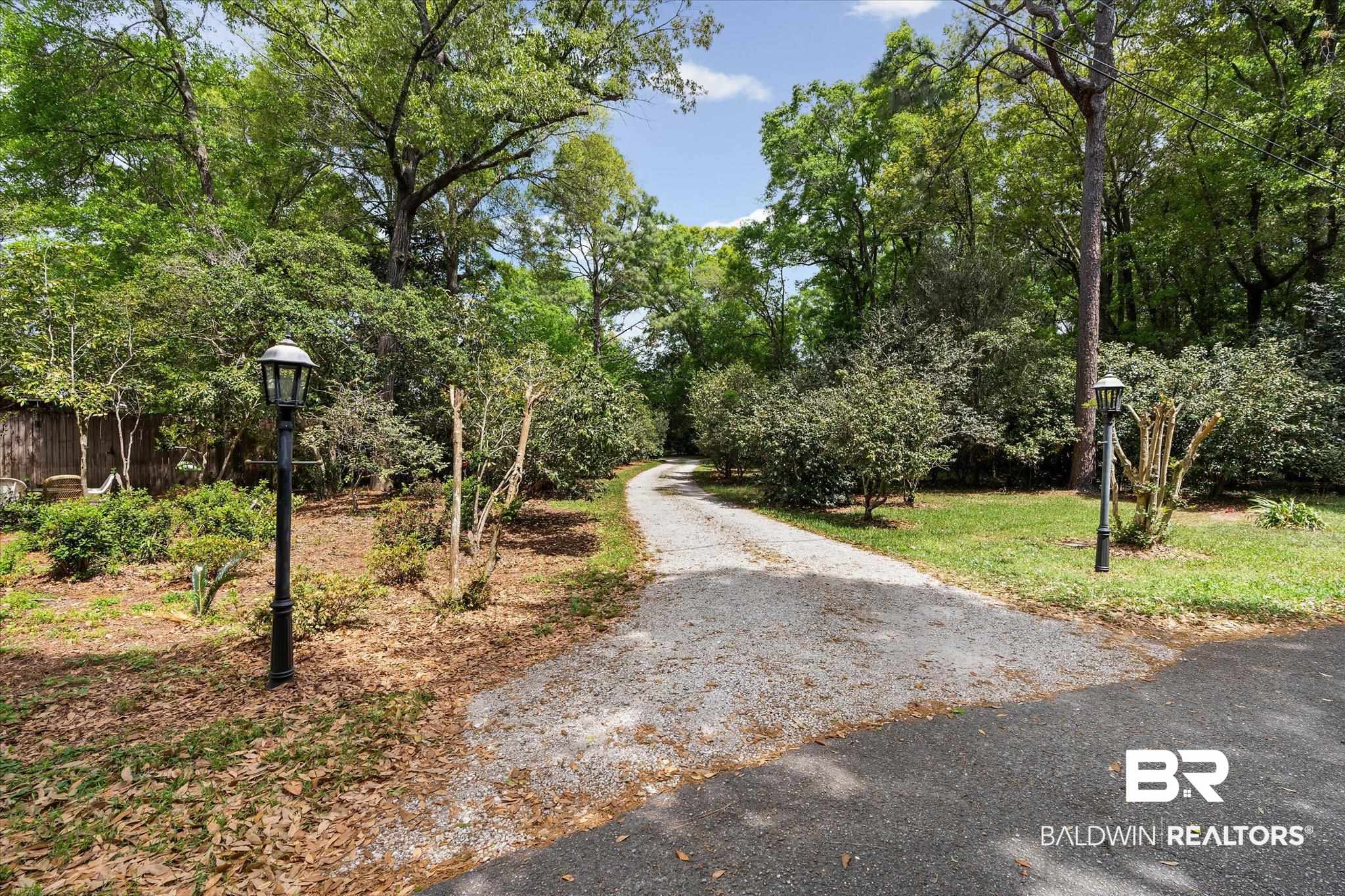 2300 Burgett Road Mobile, AL 36605 - Photo 34 of 40 View of asphalt road with street lighting