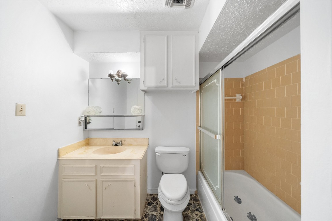 101 Walnut Coldspring, TX 77331 - Photo 11 of 37 a bathroom with a sink a toilet and shower