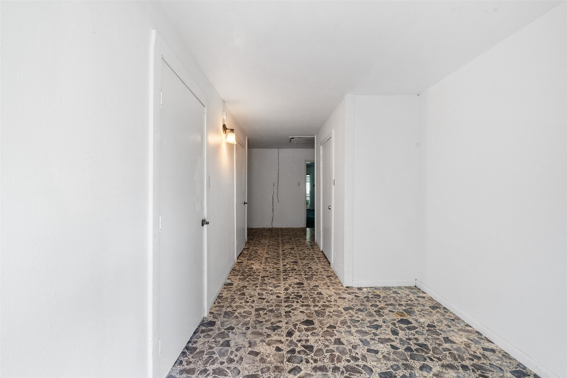 101 Walnut Coldspring, TX 77331 - Photo 18 of 37 a view of a hallway to a bedroom