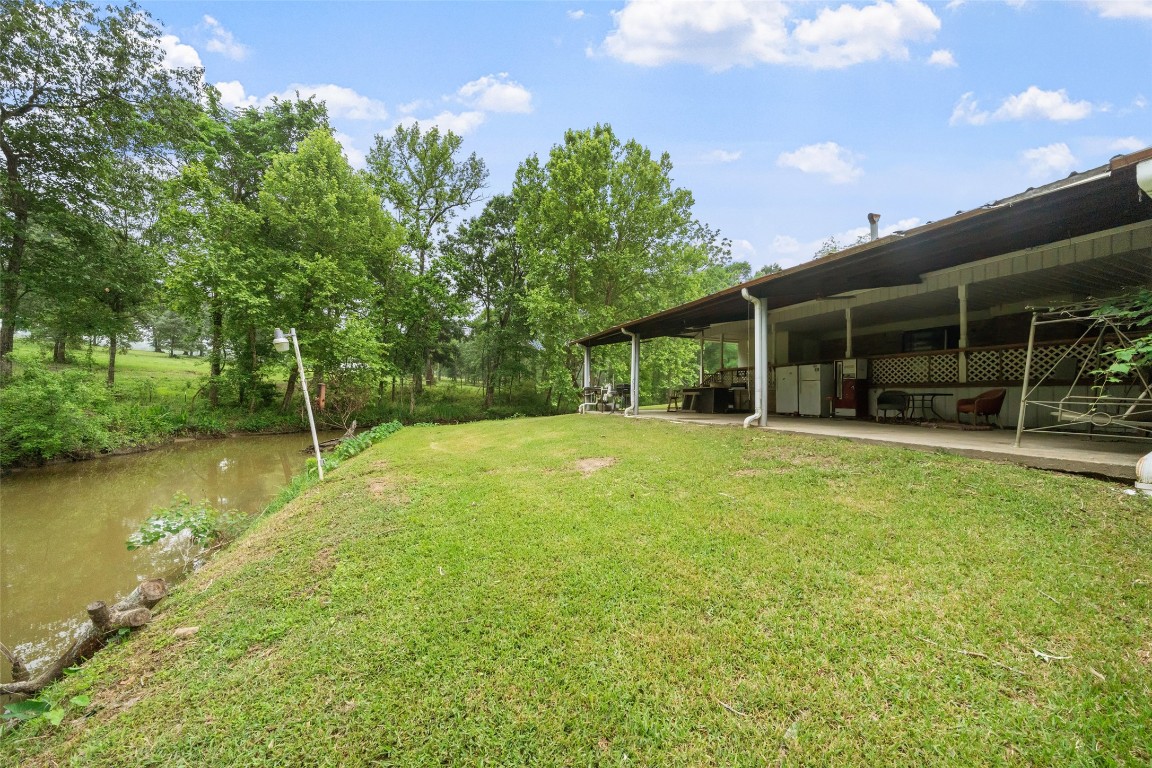 101 Walnut Coldspring, TX 77331 - Photo 2 of 37 a view of a house with backyard and porch