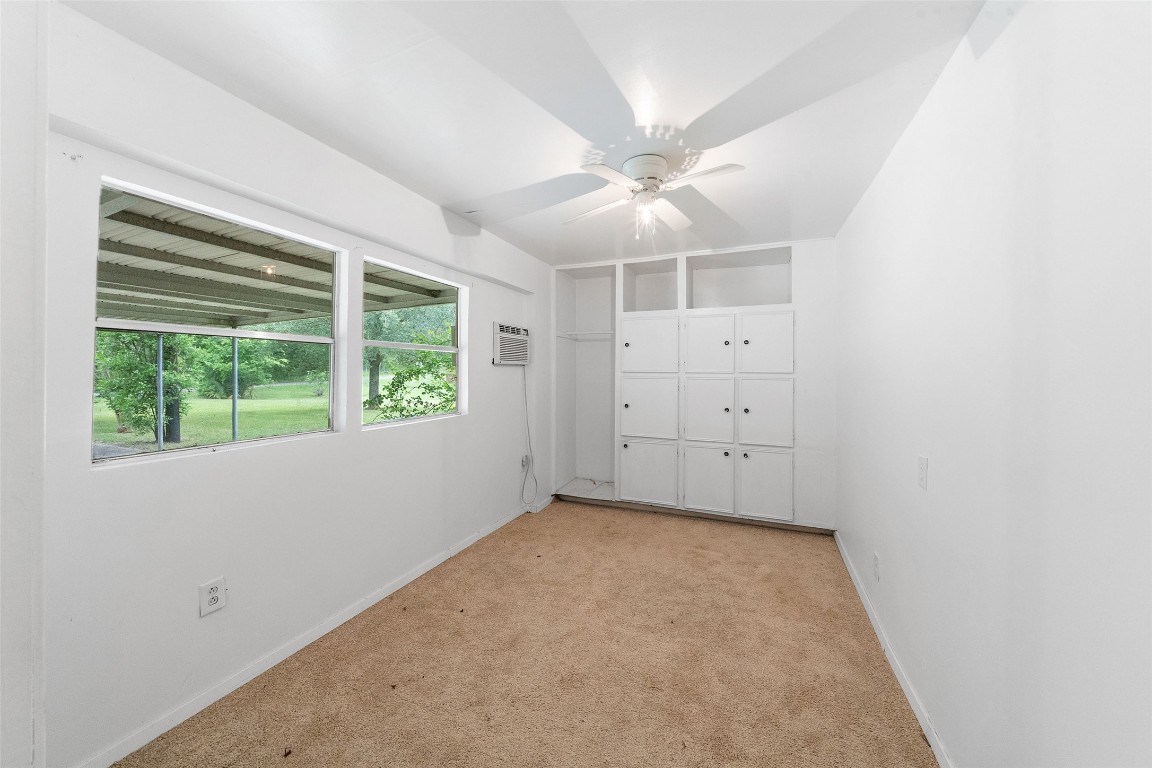 101 Walnut Coldspring, TX 77331 - Photo 23 of 37 an empty room with a window and a fan
