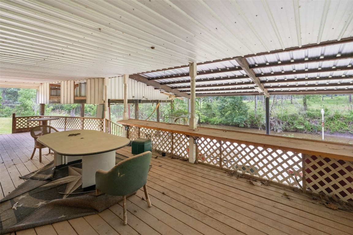 101 Walnut Coldspring, TX 77331 - Photo 26 of 37 a view of a balcony with table and chairs
