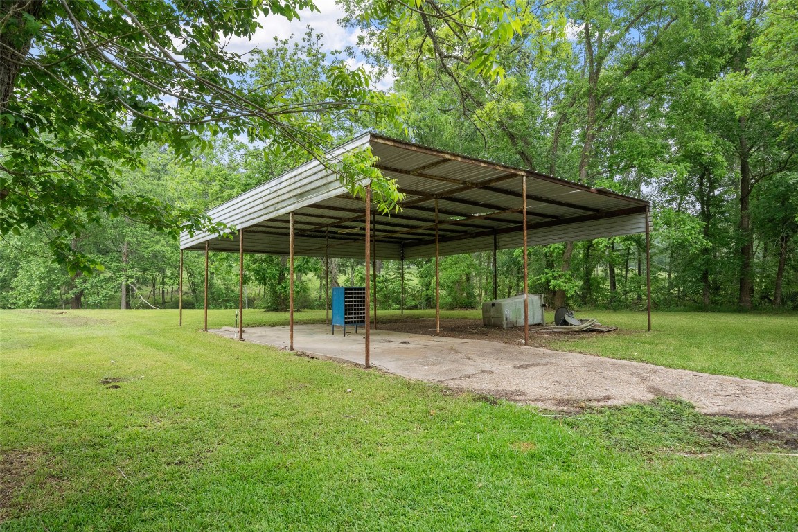 101 Walnut Coldspring, TX 77331 - Photo 3 of 37 a view of a backyard with a slide
