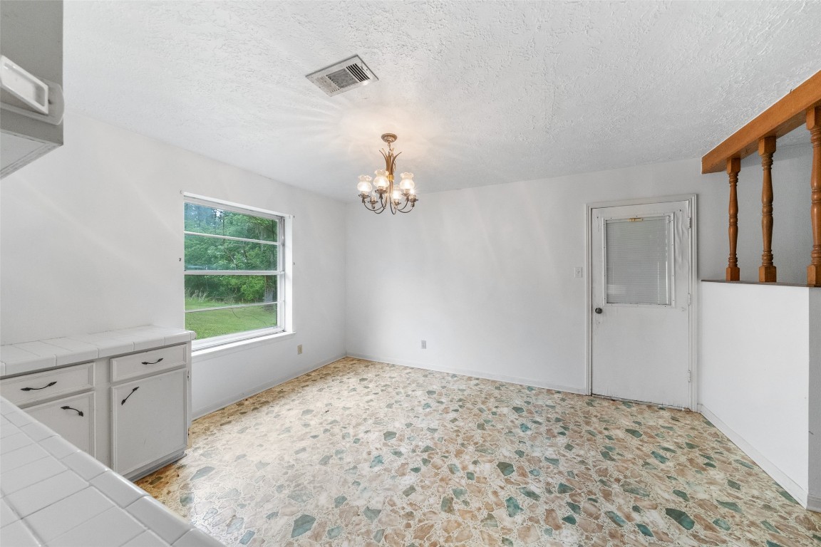 101 Walnut Coldspring, TX 77331 - Photo 10 of 37 a view of a livingroom with wooden floor and a window