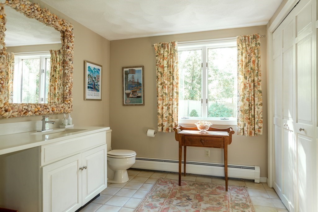 239 Argilla Road Ipswich, MA 01938 - Photo 12 of 37 a view of a bathroom with dual sinks